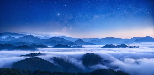 Fotobehang Slaapkamer Beautiful panoramic view starry sky above of mountain range in Lam Dong province, Vietnam  © soft_light