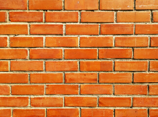 Close-up horizontal orange brick block wall. Blank background for design.