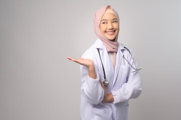 Portrait of muslim female confident doctor over white background studio, healthcare and Medical technology concept.