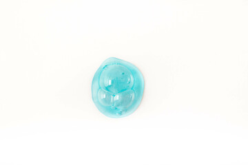 A drop of cosmetic gel on a white background. Transparent liquid gel for skin care.