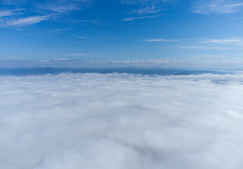 Fototapeta na wymiar Landscape above the layer of clouds