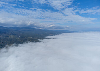 Landscape above the layer of clouds