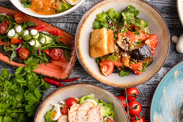 Several types of salads, many salads on a white background, side view