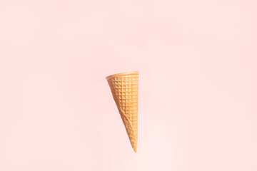 Ice cream cone on pink background
