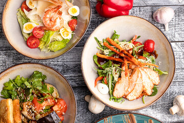 Several types of salads, many salads on a white background, side view