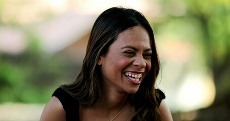 Woman natural laugh talking to friend, person laughing out loud in conversation