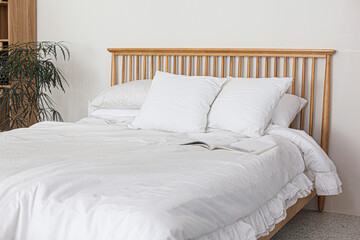 Fototapeta na wymiar bedroom interior with white sheet bed