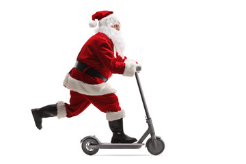 Full length profile shot of Santa Claus riding an electric scooter