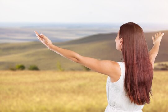Woman open arms at nature feel free