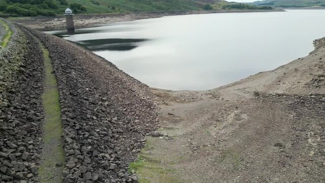Aerial shot of a river and mountains at Llyn Celyn reservoir, Wales