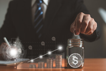 A businessman is putting coins in a glass jar and lots of coins lining up side rows and a graph showing financial growth. Investment concept, saving, saving financial accounts.