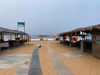 Seating arrangement in front of beach side shacks at Candolim, Goa, India.