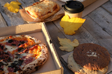 Picnic in autumn with tea and pizza