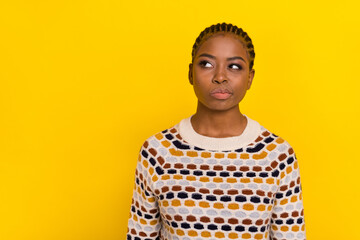 Photo portrait of young adorable girl not believe overthink empty space dressed stylish pullover isolated on yellow color background