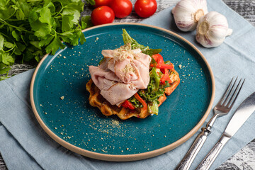 Waffles with ham, waffles with meat and vegetables on wooden white