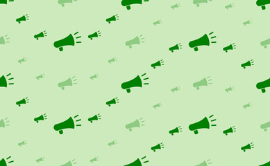 Seamless pattern of large and small green megaphone symbols. The elements are arranged in a wavy. Vector illustration on light green background
