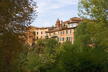 Fototapeta na wymiar Houses on Via delle Cerchia, from Orto Botanico dell'Università di Siena (aka the Botanical Gardens), Siena, Tuscany, Italy