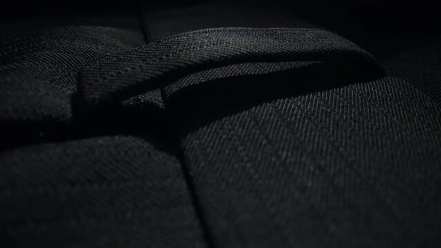 Classic black men's trousers. Close-up.