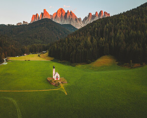 Aerial view of the church Chiesetta di San Giovanni in Ranui, Dolomites, Italy.