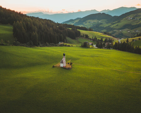 Aerial view of the church Chiesetta di San Giovanni in Ranui, Dolomites, Italy.