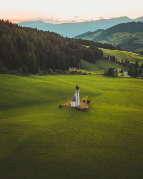 Aerial view of the church Chiesetta di San Giovanni in Ranui, Dolomites, Italy.