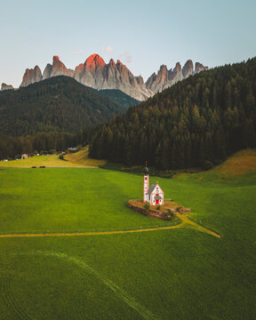 Aerial view of the church Chiesetta di San Giovanni in Ranui, Dolomites, Italy.