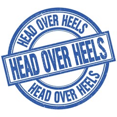 HEAD OVER HEELS written word on blue stamp sign