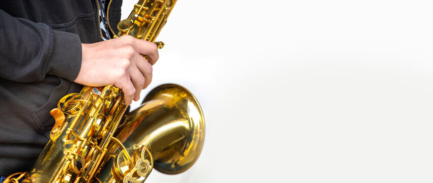 close-up of the hands of a musician playing the saxophone