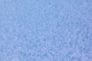 Texture of winter ice surface. Blue natural ice background