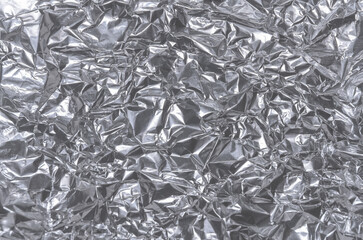 Silver metallic crumpled aluminum foil background