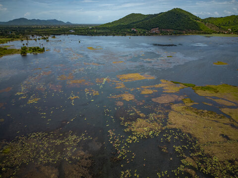 Aerial view of the Secret lake surrounded by green nature in Kampot province, Cambodia.