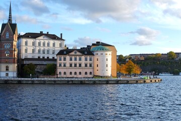 Naklejka premium Sunset hour in the heart of Stockholm. View over Riddarholmen island