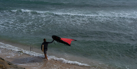 person wind foiling in tarifa