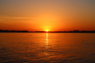 Beautiful orange sunset over the river Nile in Aswan, Egypt 