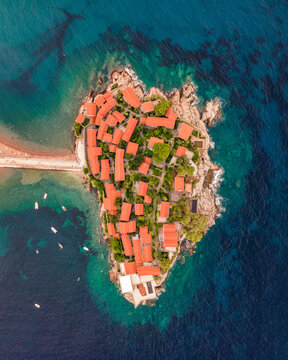 Aerial view of Sveti Stefan Peninsula, a small town in Mediterranean Sea in Balkans peninsula near Budva, Montenegro.
