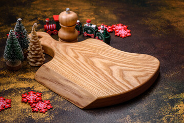 Beautiful gingerbread on a brown ceramic plate with Christmas tree decorations