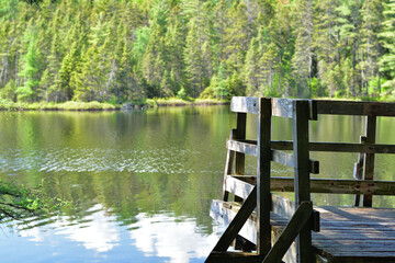 Observatory platform on lake side. Calm lake with wood platfrom.