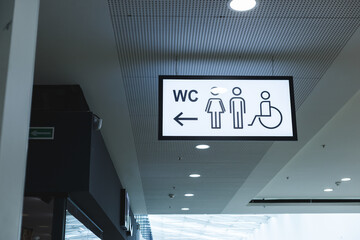 Public restroom signs with a disabled access symbol