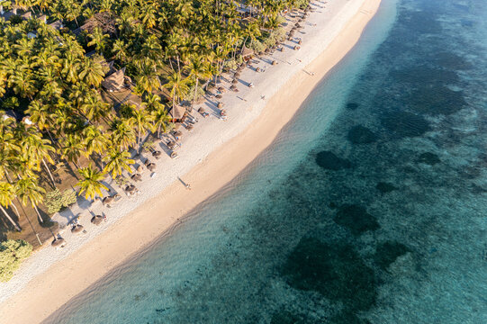 Aerial view of a beach with parasols in Flic en Flac, Mauritius, Africa.