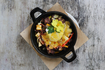 Bulalo Beef Potato Hash Skillet served in dish isolated on wooden background top view of breakfast - obrazy, fototapety, plakaty