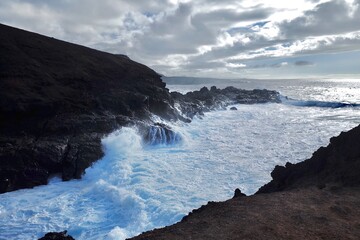 waves crashing on rocks