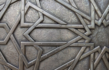 Detail of metal door with traditional islamic ornament. Copper shutter with antique and national...