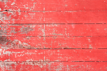 Texture of wooden planks painted with red paint