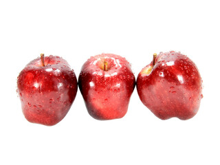 Three fresh red apples isolated on white background.Selection focus.Apples are a healthy fruit.