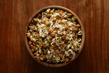 Close-up of A mix of organic sprout seeds sprouting ( germinating) bowl contains almond, groundnut,...