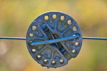electric fence wire and rope tensioner , close up view