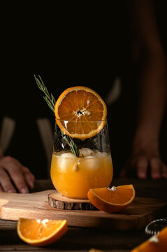 Freshly squeezed orange juice on dark background