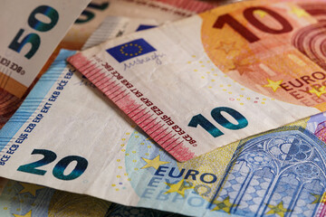 Euro banknotes on the table. Money background. 10, 20 and 50 euro banknotes close-up, soft focus
