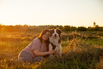 Portrait of   woman with  dog on  walk