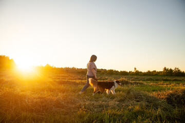 Portrait of   woman with  dog on  walk